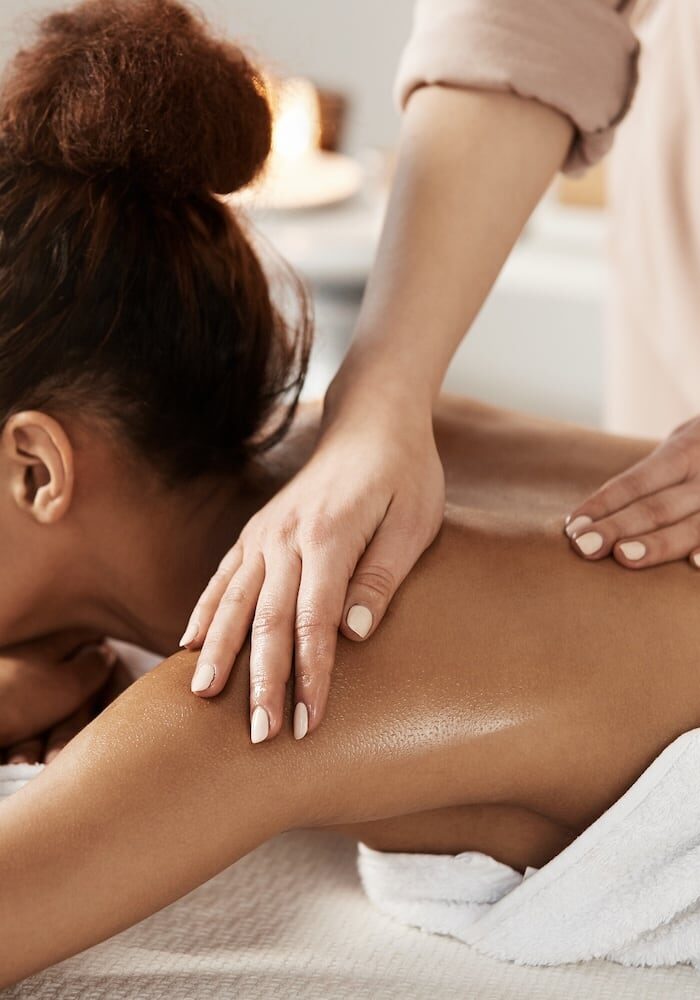 woman-having-massage-relaxing-spa-salon-closed-eyes